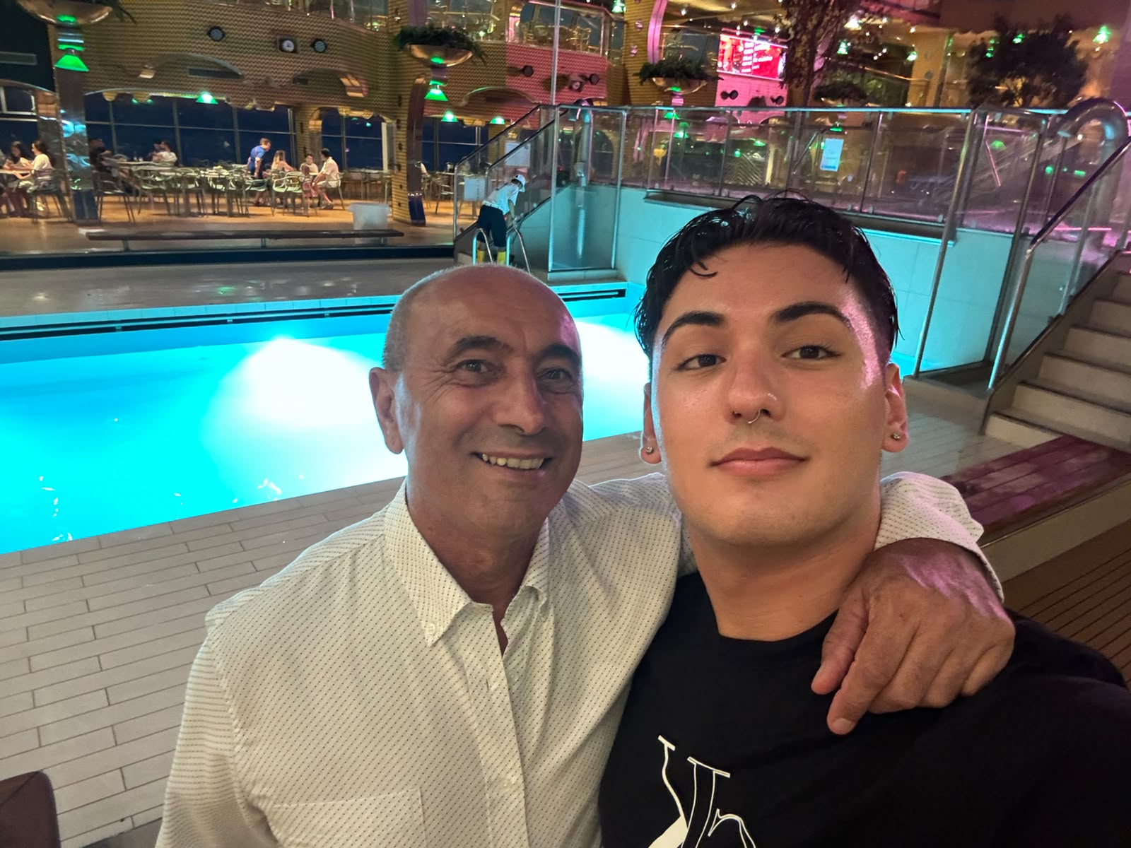 Raymond and Clayton by the pool at night